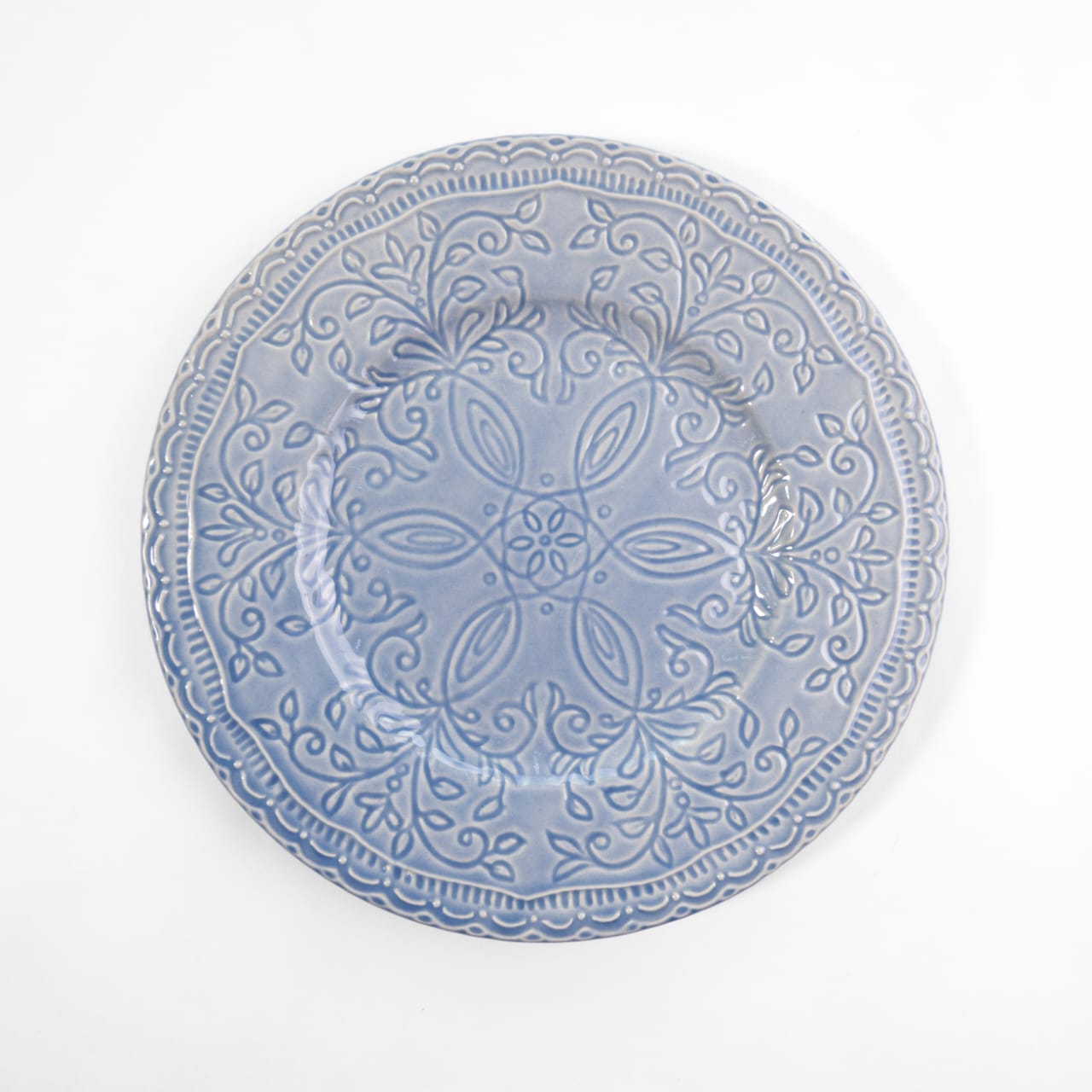 A top-down view of four 7.5-inch bone china quarter plates in pastel and blue, featuring intricate engraved floral and geometric patterns
