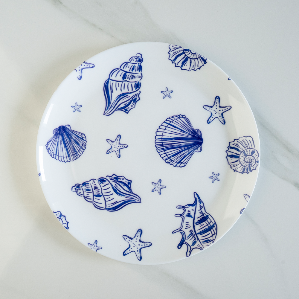 Bone china quarter plate featuring a blue nautical pattern with shells and starfish