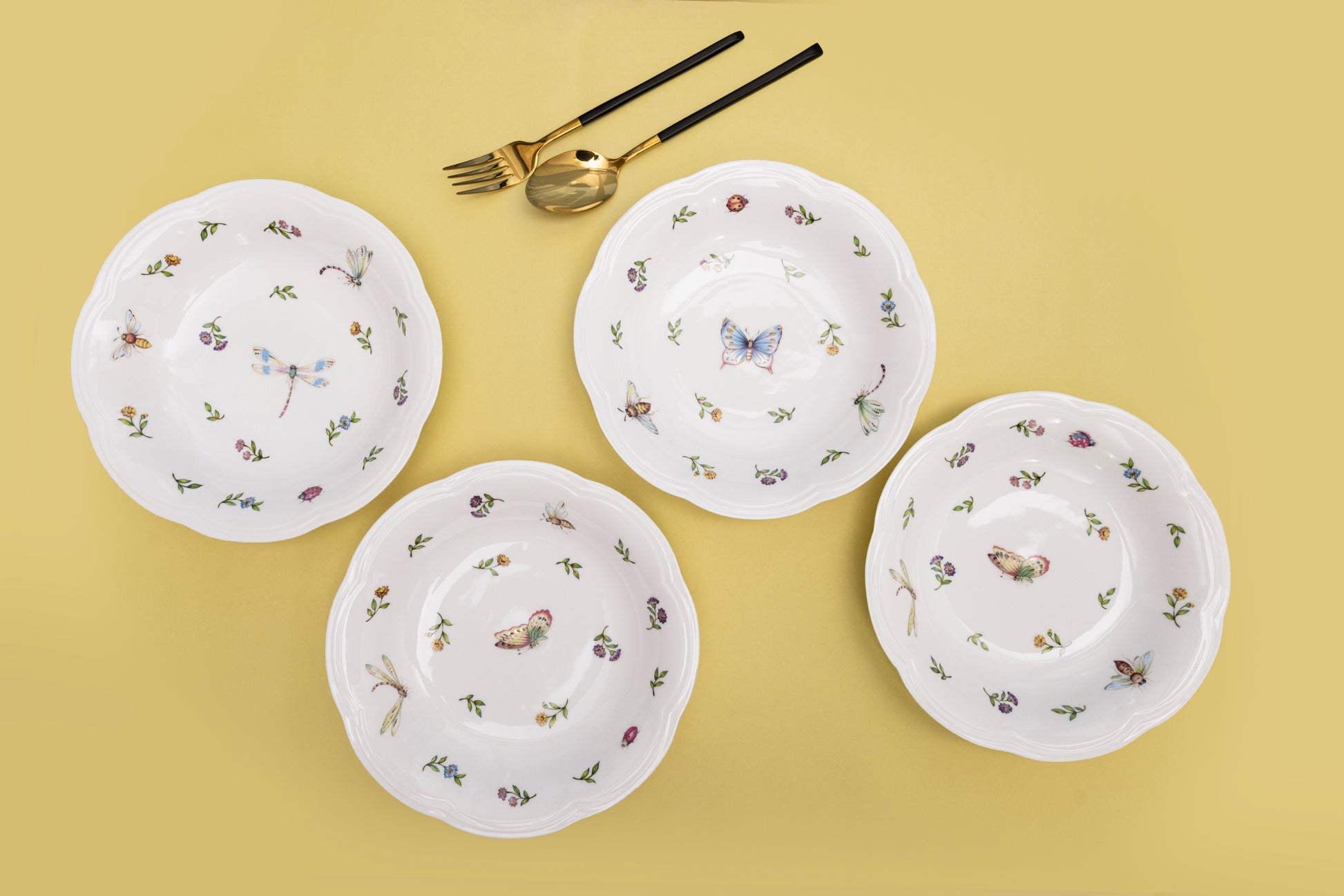 Bone china Enchanted Garden four deep dishes with assorted butterfly, dragonfly, and bee motifs