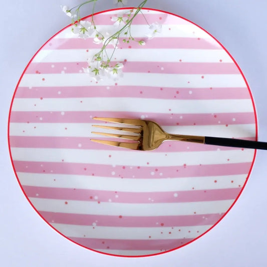A round white bone china quarter plate with horizontal pink and white stripes, a thin red rim, and small gold star details - Birdy Home Design