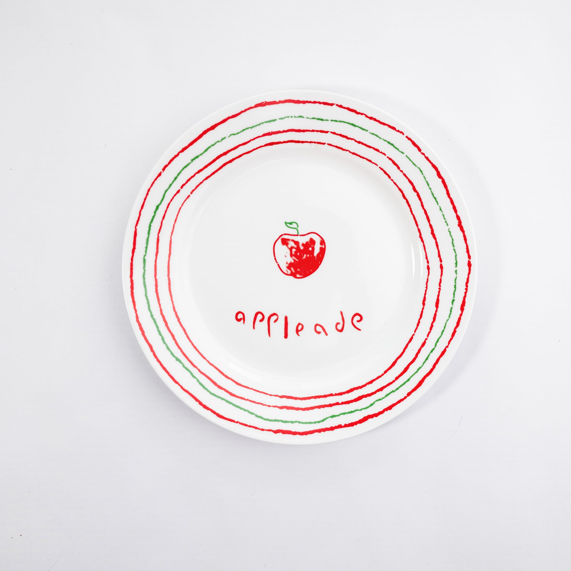 White bone china quarter plate with the Appleade style featuring a red apple and red and green circular borders