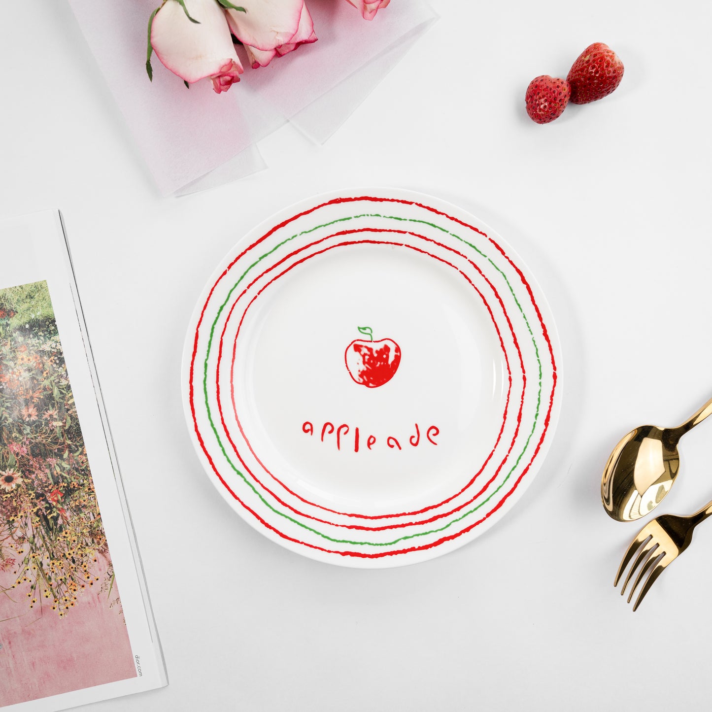 Top-down view of a white bone china quarter plate in the Appleade style featuring a red apple and red and green circular borders