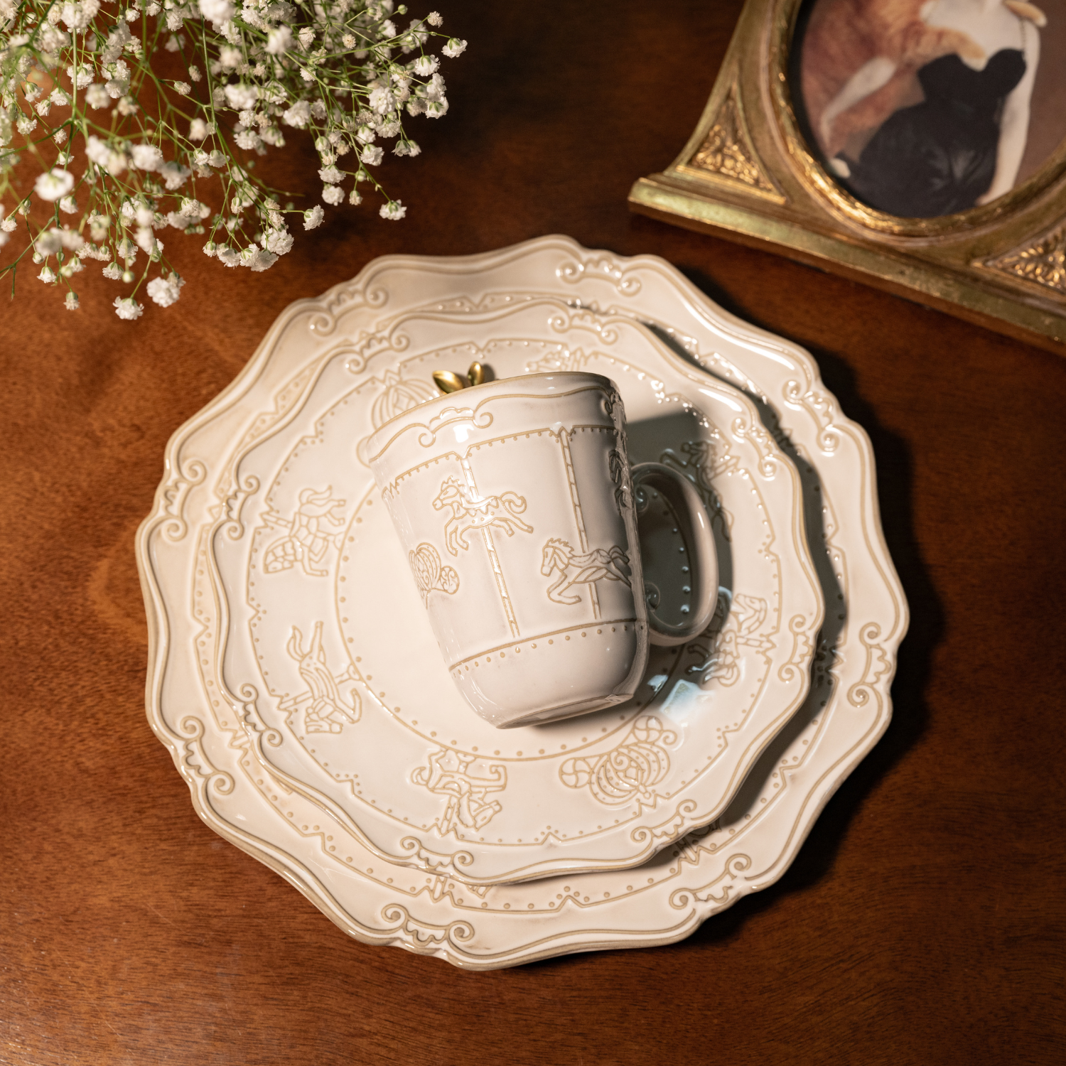 A matching three-piece bone china dinnerware collection featuring a 10-inch dinner plate, a 7-inch quarter plate, and a matching mug, all adorned with intricate embossed carnival merry-go-round horse carvings - Birdy Home Design
