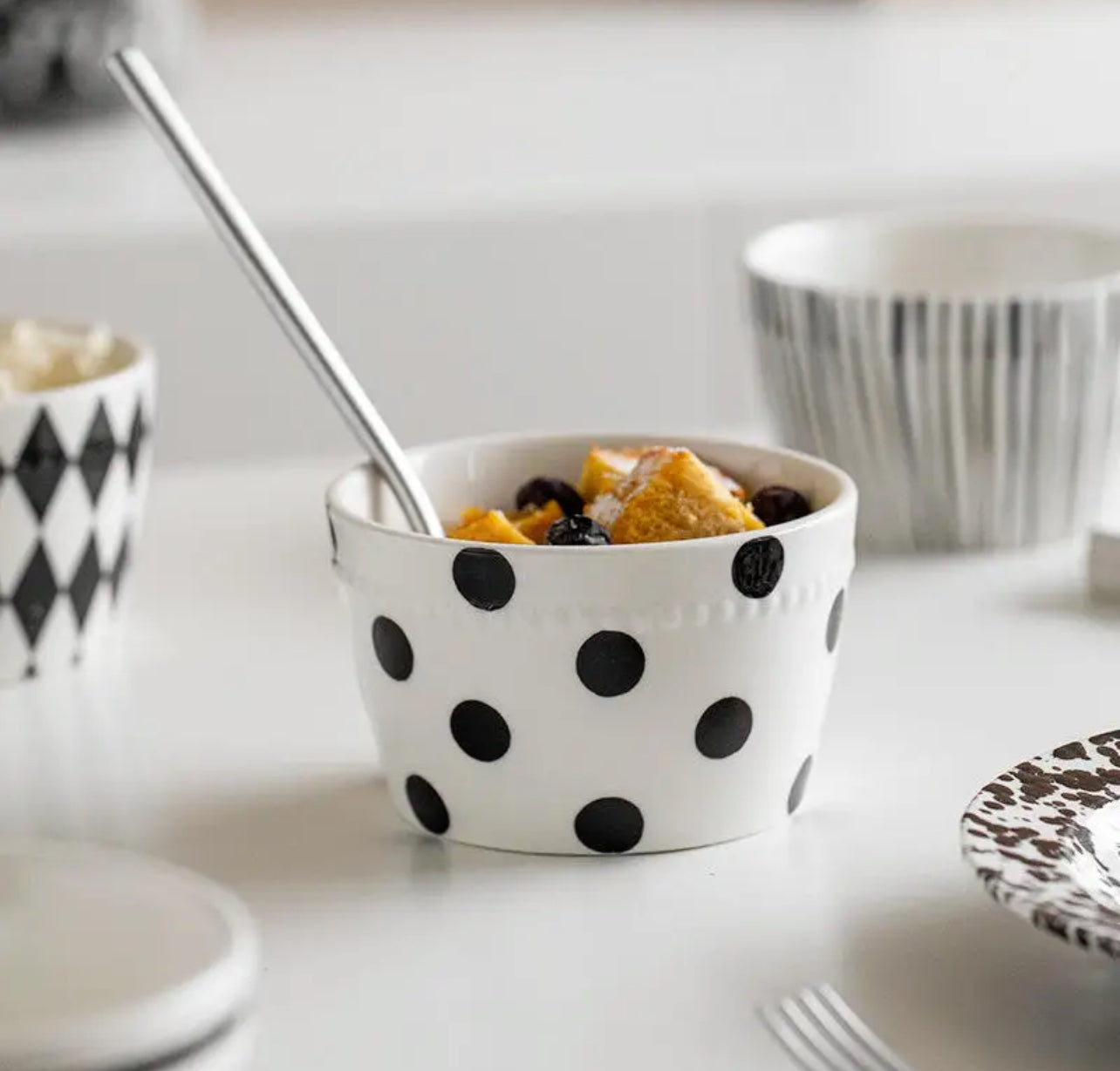 Bone china Nordic and Korean style bowl featuring a black polka dot pattern on a white background