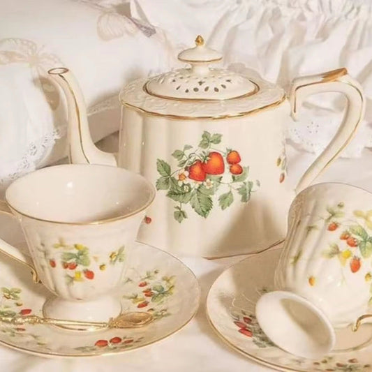Bone china strawberries and cream teapot and sugar pot with floral pattern styled on white draped cloth - Birdy Home Design