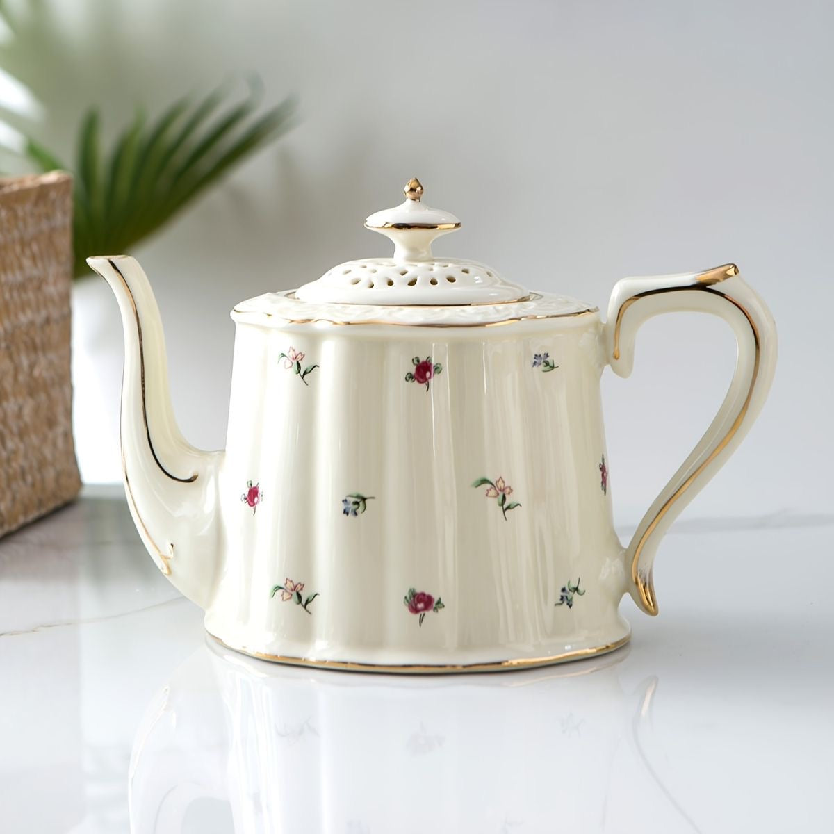 Bone china daisy fields teapot with scattered floral motif, gold rim and lattice lid, front product shot