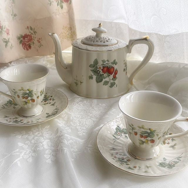 Bone china strawberries and cream teapot with two cups and saucers with strawberry motif and gold rim
