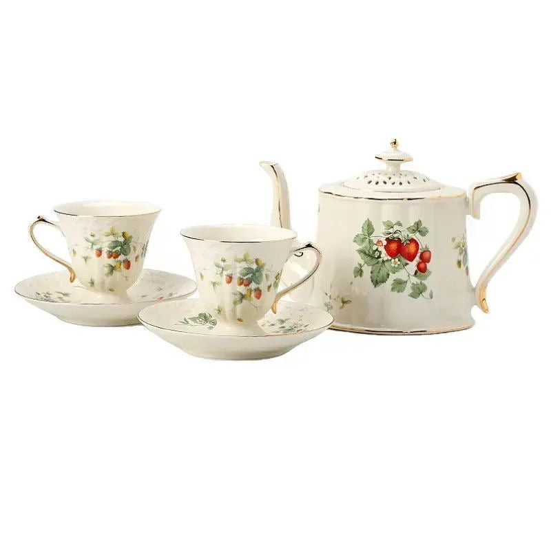 Bone china strawberries and cream teapot with two cups and saucers, clean white background product shot