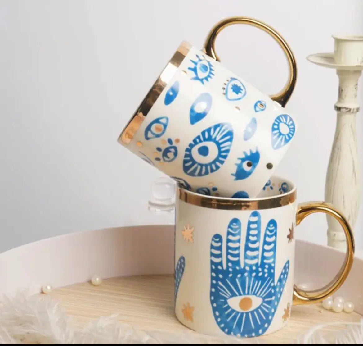 Bone china Turkish Evil Eye mugs featuring hand and eye designs with gold handles