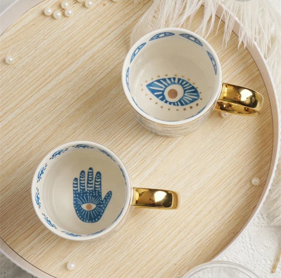 Bone china Turkish Evil Eye mugs top view showing the interior hand and eye motifs