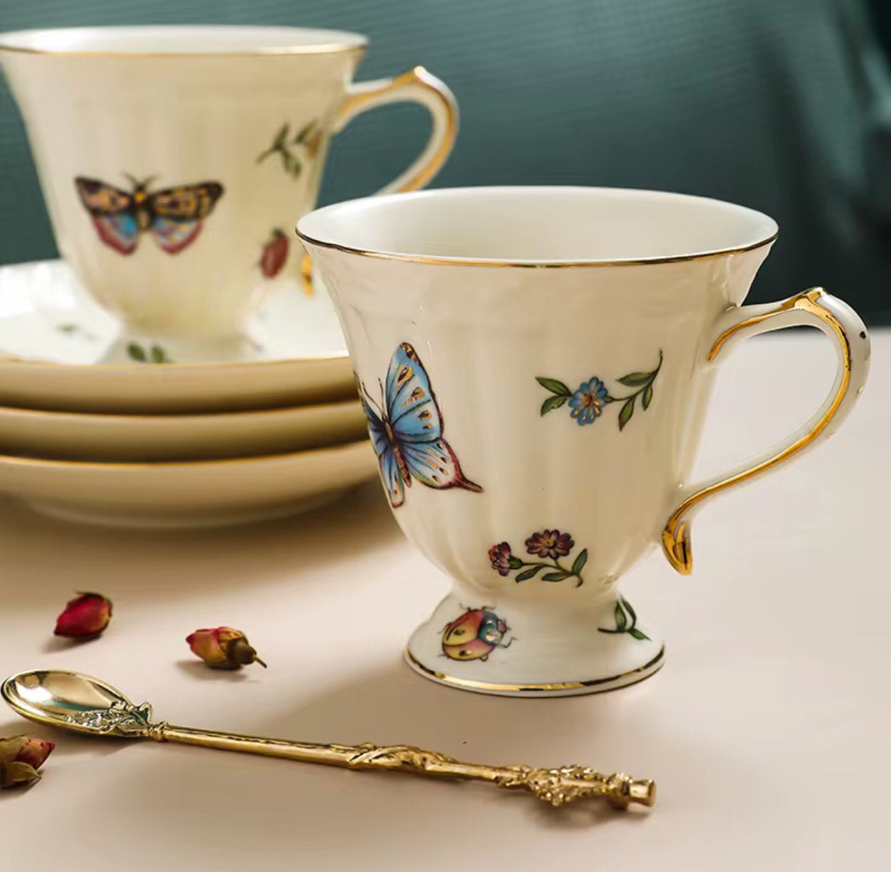 Bone china enchanted gardens two cups and saucers with butterfly and insect motif, gold rim and gold spoon